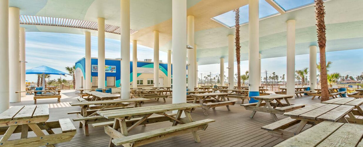 Isla Blanca Sandpiper Pavilion with wooden picnic tables